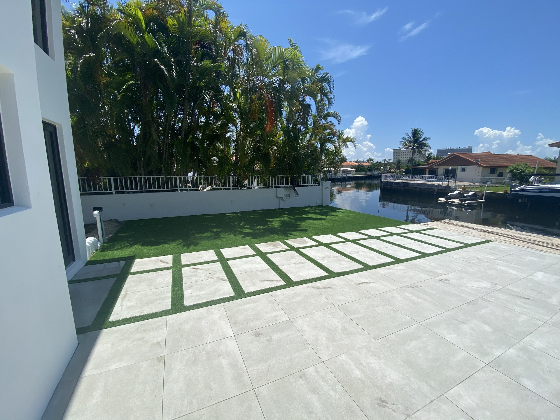 Luxury poolside turf installation South Florida before and after after