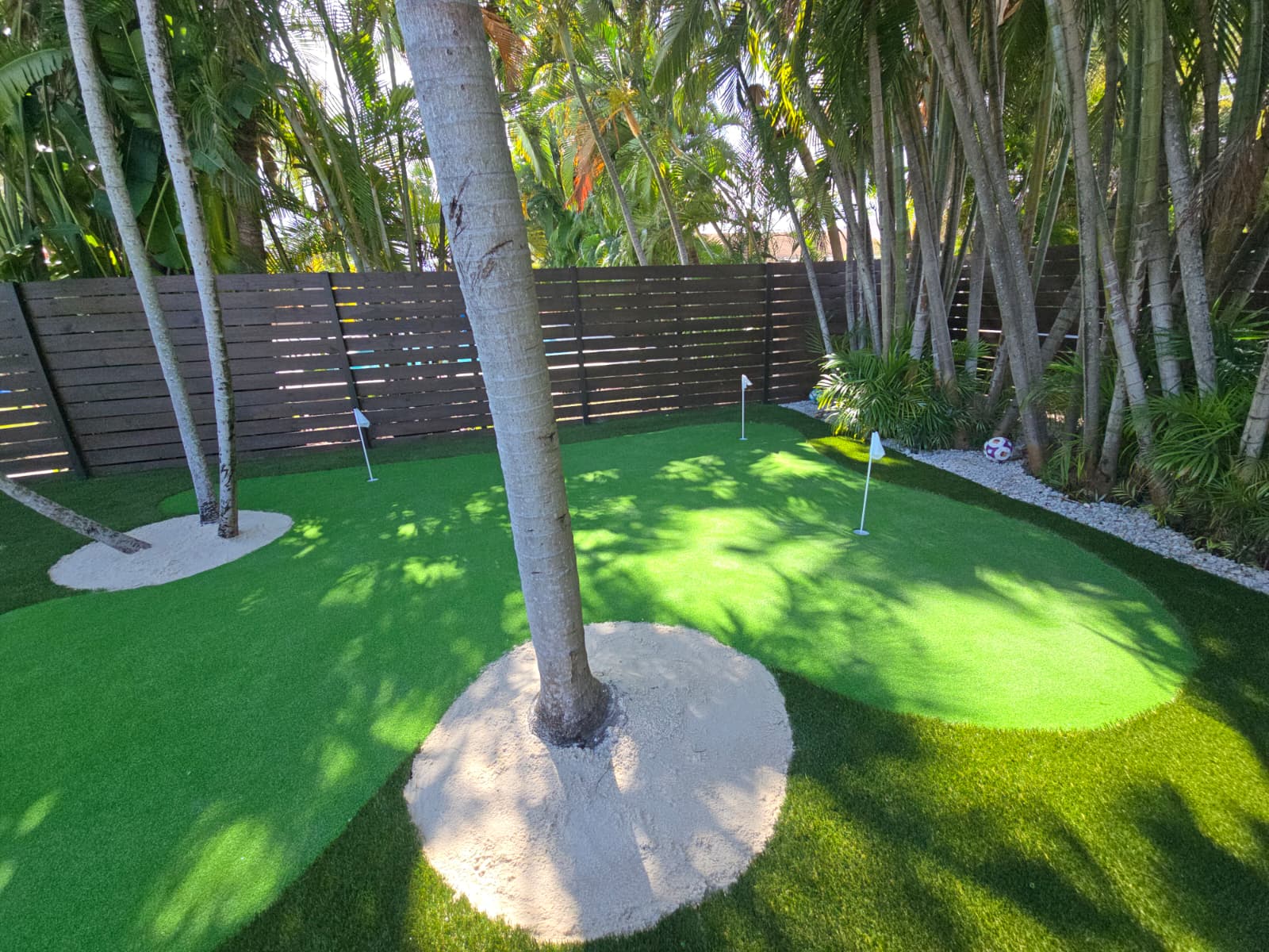Custom backyard putting green installation before and after after
